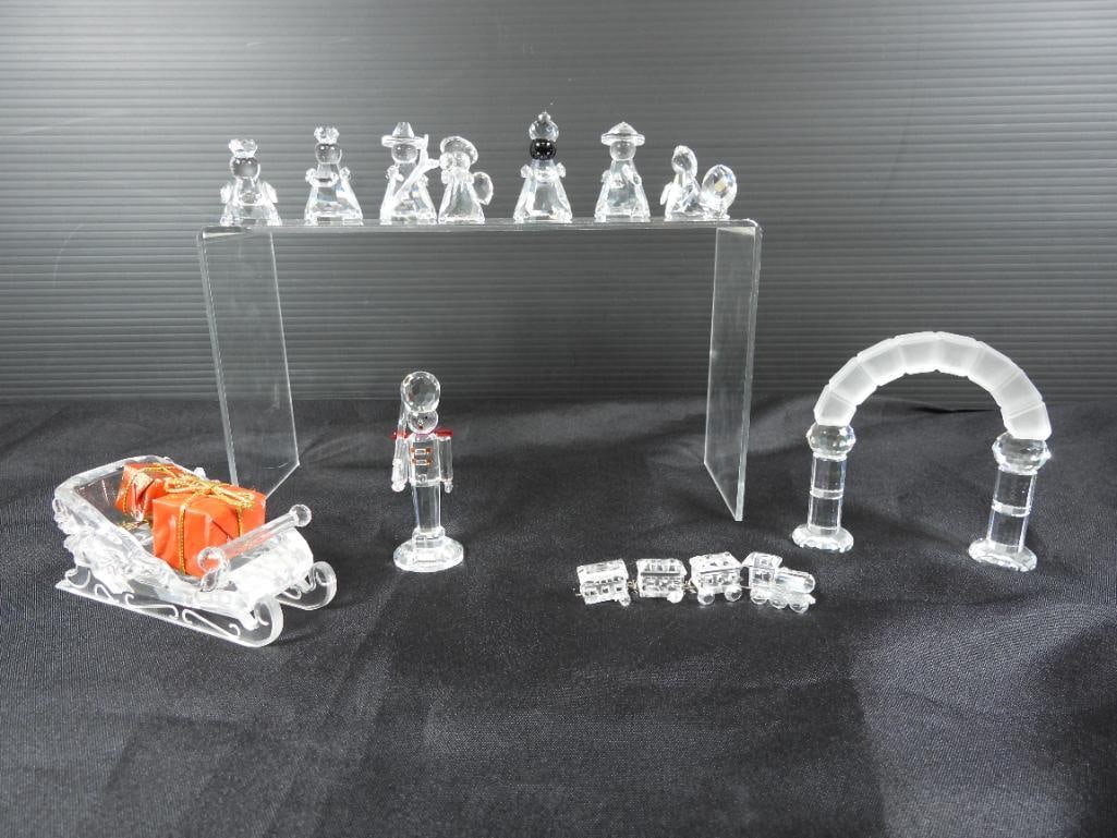 Lot of 15 Swarovski crystal winter collections: Included are several mint condition Swarovski crystal pieces from the nativity set, to a nutcracker, a small train set, and a sled with presents