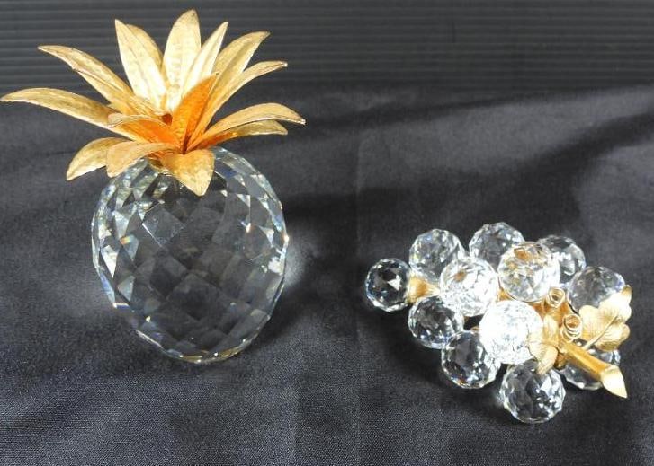 Lot of 2 Swarovski crystal fruit set: 2 Swarovski crystal fruit designs featuring a pineapple with gold leaves and a cluster of grapes with a gold stem