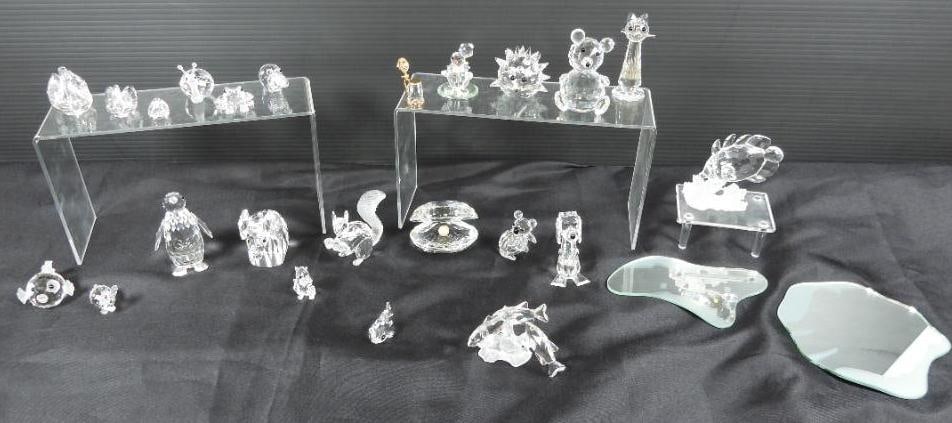Lot of 26 Swarovski crystal animals and critter: 26 crafted bears, fish, a clam with a pearl, snail, swans, elephant, cat & dog, clown, tankard, and 2 mirror bases for display all in mint condition