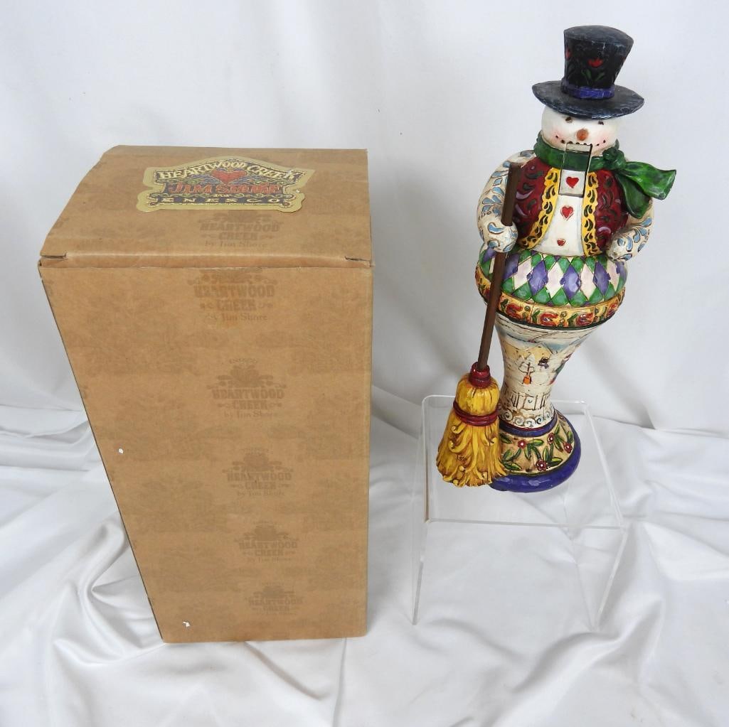 Jim Shore "In Sweeps Winter's Fun" in Box: Featuring a Jim Shore styled snowman nutcracker holding a broom, this piece is part of the 2005 heartwood collection and is in perfect condition #4002413
