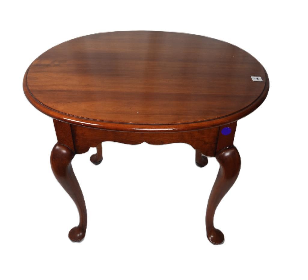Vintage Cherry oval end table: Label on underside states Oct. 30th 1970 Centennial, item otherwise is in moderate condition with some nicks and scrapes on its surface