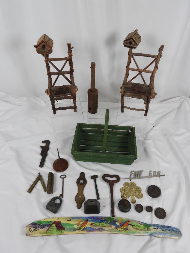 Lot of 22 various Knick knacks and souvenirs: Included in this lot are 2 wooden miniature chairs with birdhouses, a green basket of various metal products such as weighted slugs, an oil can, and keys; also included are a possible vintage lemon