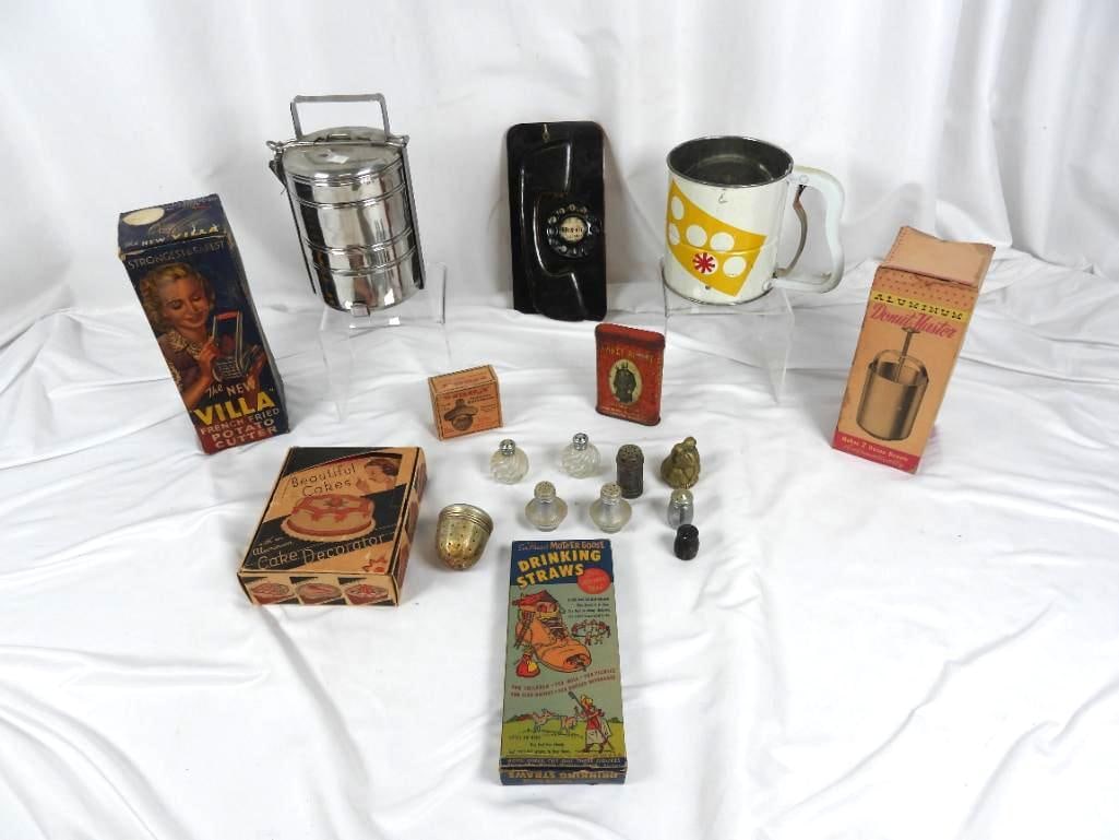 Lot of 16 vintage kitchen utilities: Several vintage cooking products still in their original box are included such as a donut maker, plastic drinking straws, "Villa" potato slicer, a metal 4 tiered storage lunch box, and a cake