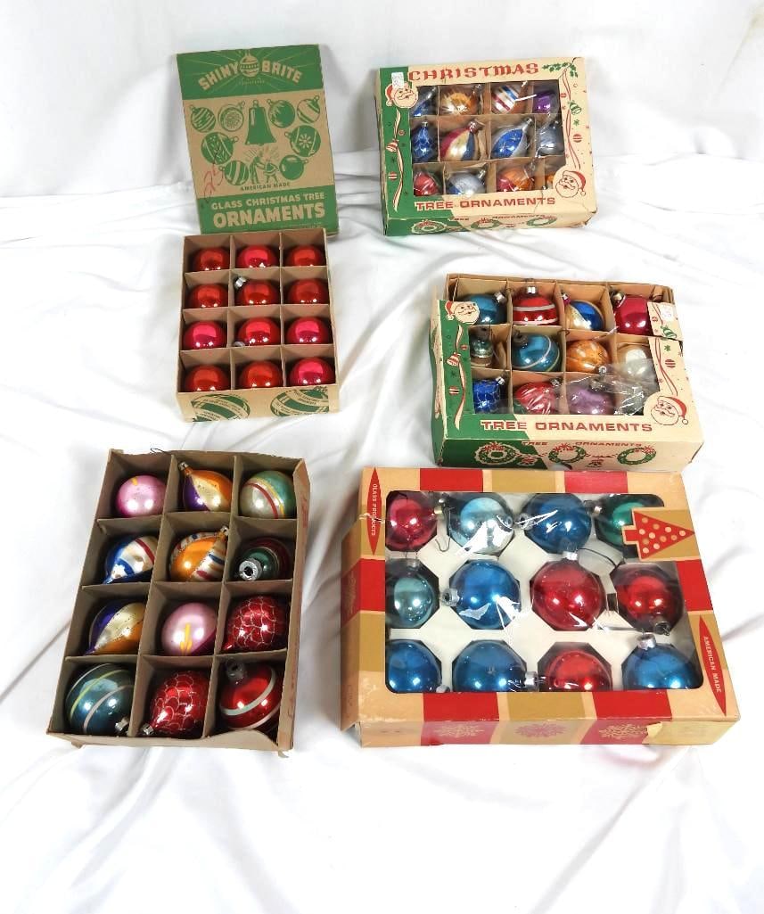 Lot of vintage Christmas balls: 2 cases house uniform Xmas Balls while 3 other hold various shapes and colors made by Premier Glass Works Inc. and Shine Brite factories made in the USA