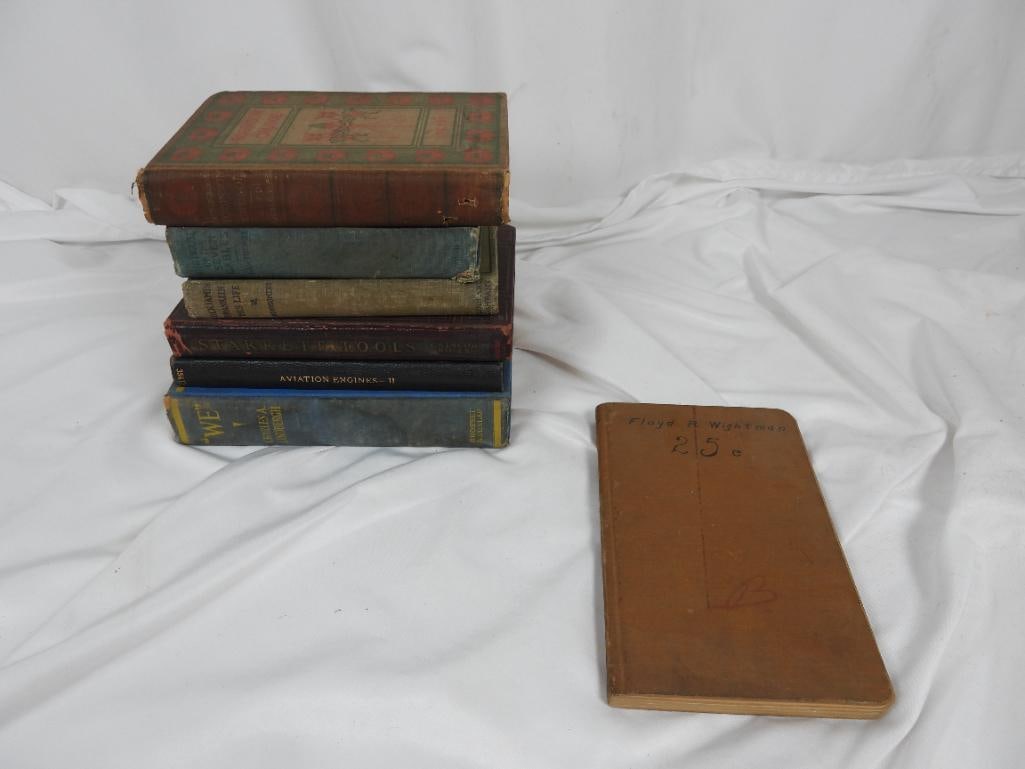 Lot of 7 vintage books: Titles included are "The Life and Adventure of Robinson Crusoe", "The house of Seven Gables", Benjamin Franklin: His Life", "Fine Mechanical Tools", "Aviation Engines Book 2", "WE", and a notebook by 