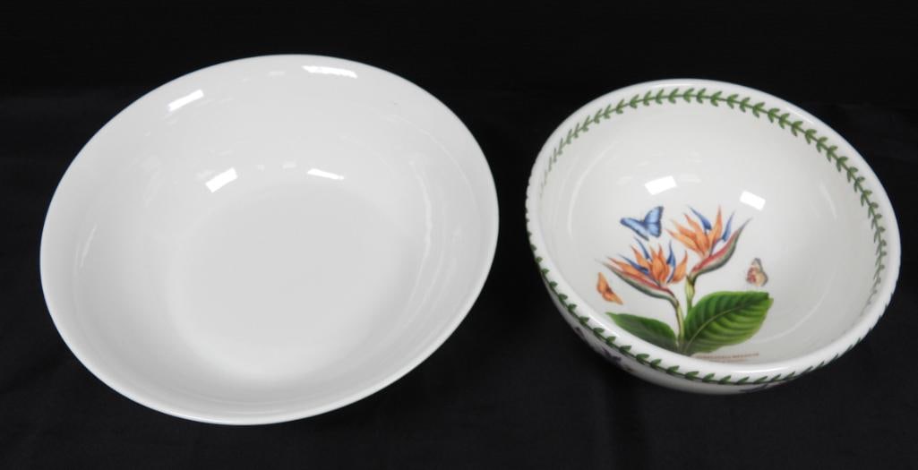 Lot of 2 Portmeirion & Mikasa bowls: Portmeirion bowl is made in England and decorated with botanical wildflowers such as columbine, red ginger, and phalaenopsis orchid with a large bird of paradise on its face. The Mikasa bowl is much m