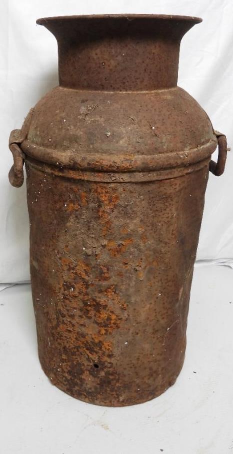 Vintage Milk Container: Steel Milk container with two handles by its lip holds 3 to four gallons of liquid and shows rust around its body