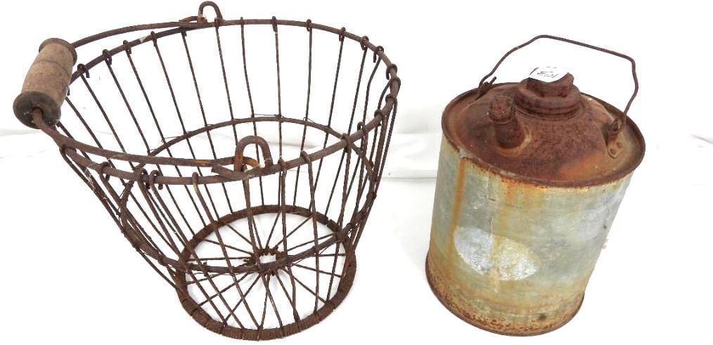 Antique Primitive Metal Wire Egg basket and metal fuel can lot: Wonderful egg basket metal with rust measures: 11" diameter top, 8" diameter bottom x 9" high. Wooden handle. Fuel Gas/ kerosene can visible rust. Measures: 9.75" h to that top of the spout x 6-5/8" d