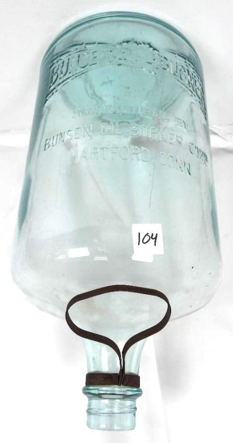 Vintage Blue BUNSEN OIL BURNER Glass Jug: Embossed light blue glass jug with metal handle around the neck. Embossed "BUNSEN OIL BURNER . MANUFACTURED BY BUNSEN OIL BURNER CORP. HARTFORD CONN. Measures: 18" h x 9" diameter.