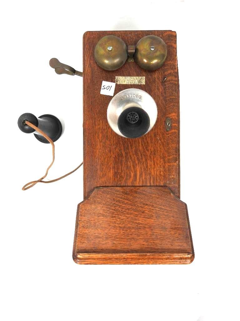 Antique KELLOGG Wall mount telephone: Features a wooden cabinet with brass and metal components. Complete with hand crank, bell, cord and and mouth piece. There are inner components attached in the case. Cannot guarantee function or compl