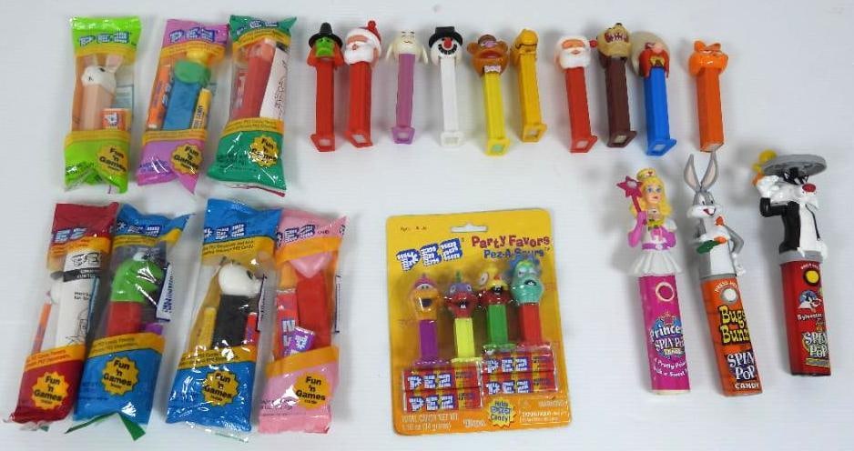Tray lot of 20 Pez dispensers & 3 Spin pops some vintage?: NOT FOR CONSUMPTION. FOR DISPLAY ONLY. CHILD SAFETY NOT GUARANTEED. WE ASSUME NO LIABILITY FOR INJURY OR ILLNESS. Spin pops feature a princess, bugs bunny and Sylvester. Pez include character seasonal