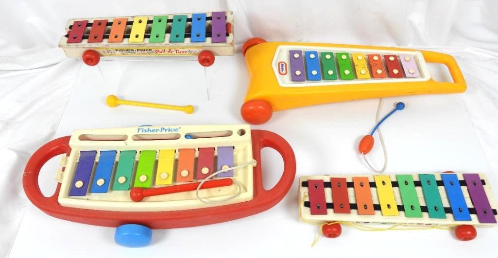 Lot of 4 Vintage Little tikes & Fisher price Xylophones: FOR DISPLAY ONLY. CHILD SAFETY NOT GUARANTEED. WE ASSUME NO LIABILITY FOR INJURY OR ILLNESS. Plastic Little tikes, 2 fisher price.1 x 1964 Fisher Price WOODEN xylophone. All have their pull cords and 