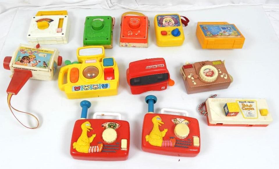 Lot of 11 Fisher Price & Playskool Radio, Video musical toys: FOR DISPLAY ONLY. CHILD SAFETY NOT GUARANTEED. WE ASSUME NO LIABILITY FOR INJURY OR ILLNESS. Lisher price movie box camera, 5 wind up music box radios, 3 ILLCO camera's (2 are sesame street and cabbag