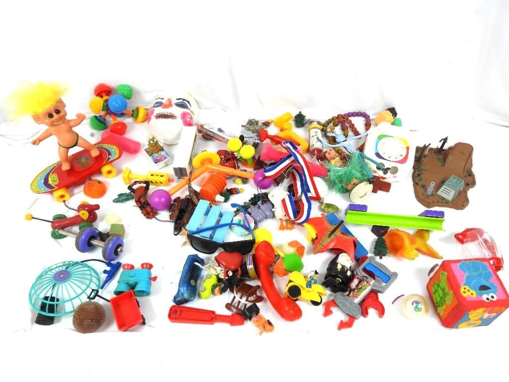 Vintage to new assorted toy and parts lot: FOR DISPLAY ONLY. CHILD SAFETY NOT GUARANTEED. WE ASSUME NO LIABILITY FOR INJURY OR ILLNESS. Includes a large 8" plastic troll 360 on a skateboard, Wooden cross, rubber figures, sesame street, figurin