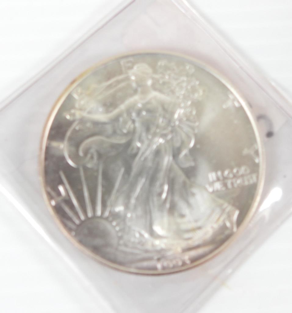 1993 Walking Liberty Silver Dollar: One ounce 0.999 Fine Silver in plastic sleeve