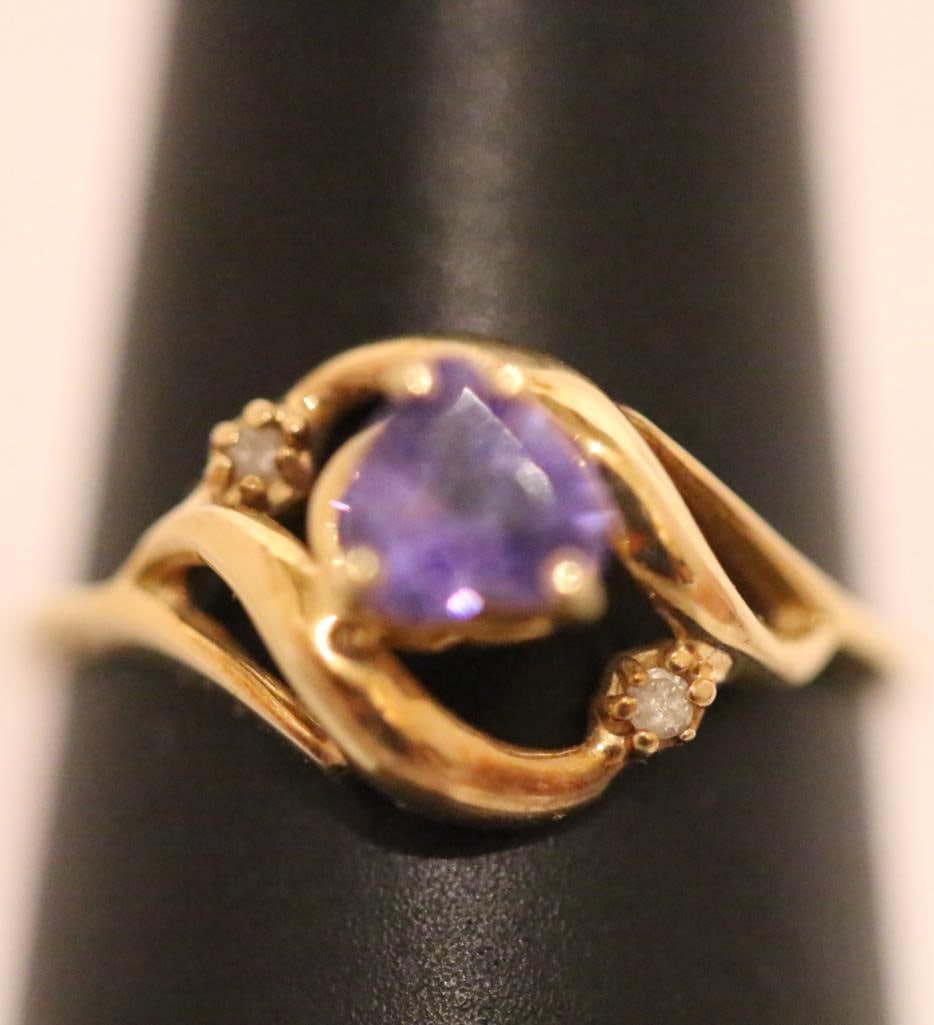 14KT Gold Diamond Heart Tourmaline ring Sze. 6: Weighs 1.8 grams Hallmarked 14KT. Gorgeous violet tourmaline heart flanked by 2 small diamonds. Tested all stones and gold. Heart is approx. 5.25mm. Presented in a ring box.