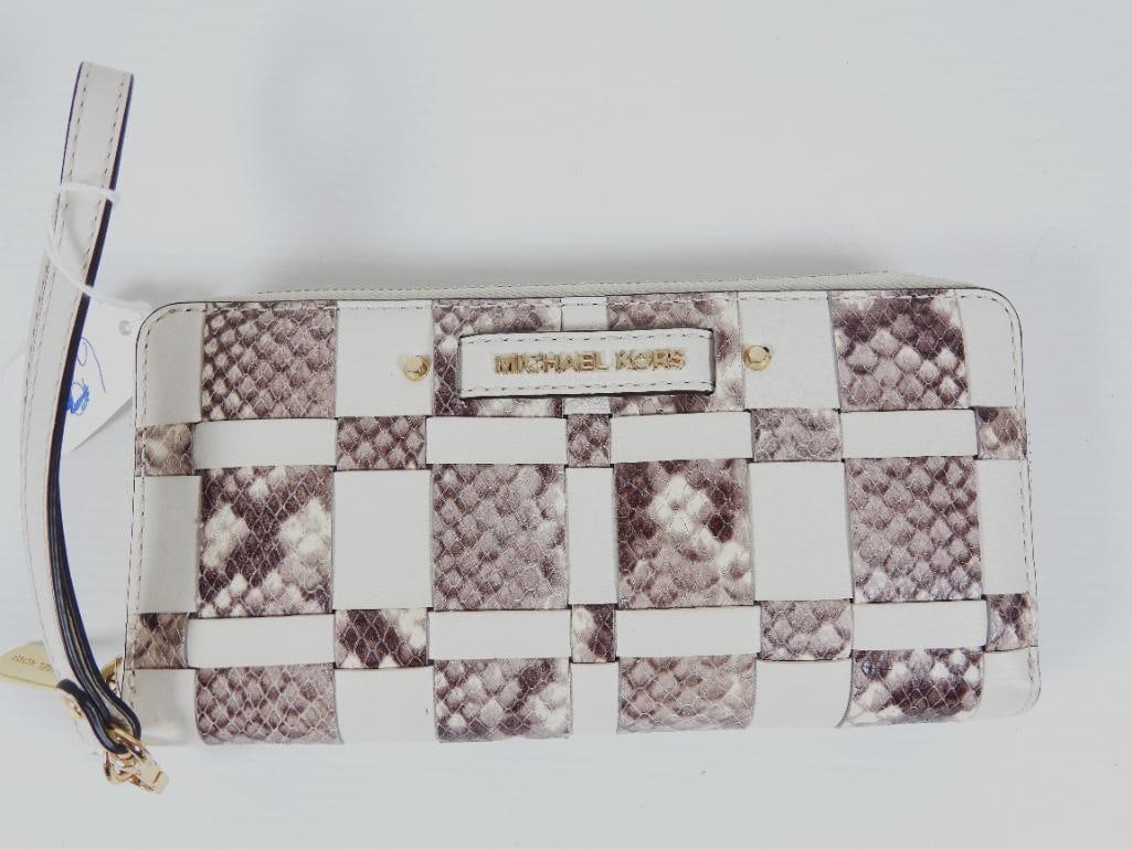 AUTHENTIC MICHAEL KORS Vivian Continental travel wallet: GUARANTEED AUTHENTIC Ladies MICHAEL KORS Designer VIVIn TRAVEL WALLET WITH CARRYING STRAP, FULL ZIP AROUND. ECRU / natural Ivory leather with snakeskin braided weave. RETAILS $268.00. Coordinates nice