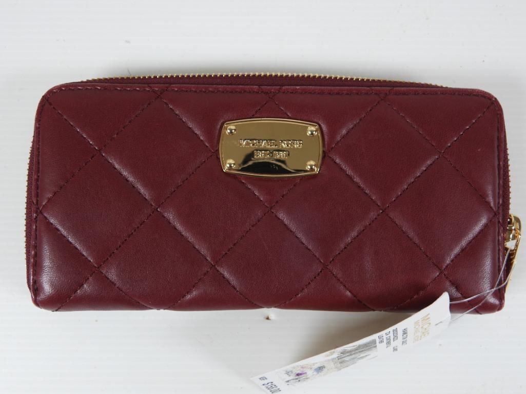 NEW AUTHENTIC MICHAEL KORS Hamilton Quilt Continental Wallet: NEW with Tags. GUARANTEED AUTHENTIC Ladies Designer MICHAEL Clasp around. Bright brass hardware with MICHEL KORS EST. 1981 plate on the front of the wallet. Features full zip around, 2 bill pockets, c