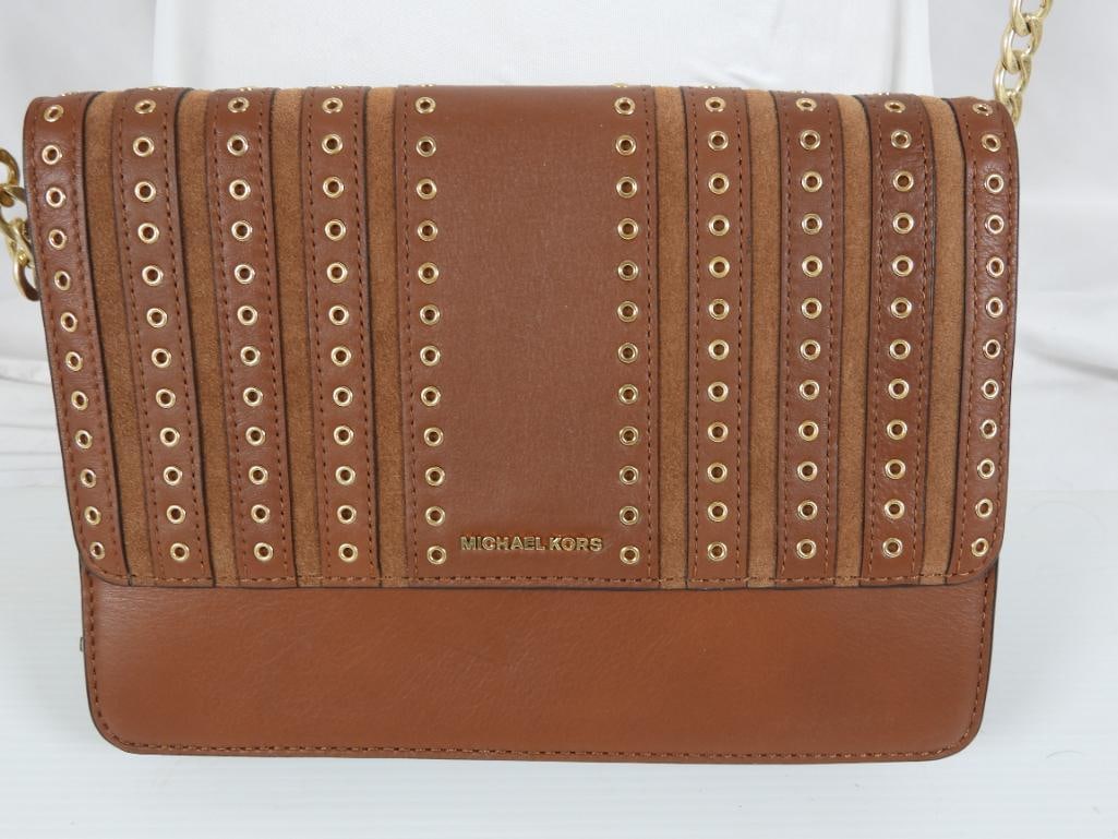 NEW AUTHENTIC MICHAEL KORS Brooklyn Leather Cross body Bag: NEW GUARANTEED AUTHENTIC MICHAEL KORS Ladies Designer BROOKLYN Grommet Large Leather Crossbody hand bag in Caramel Brown featuring gold tone grommets and hardware. Adjustable gold tone leather strap. 