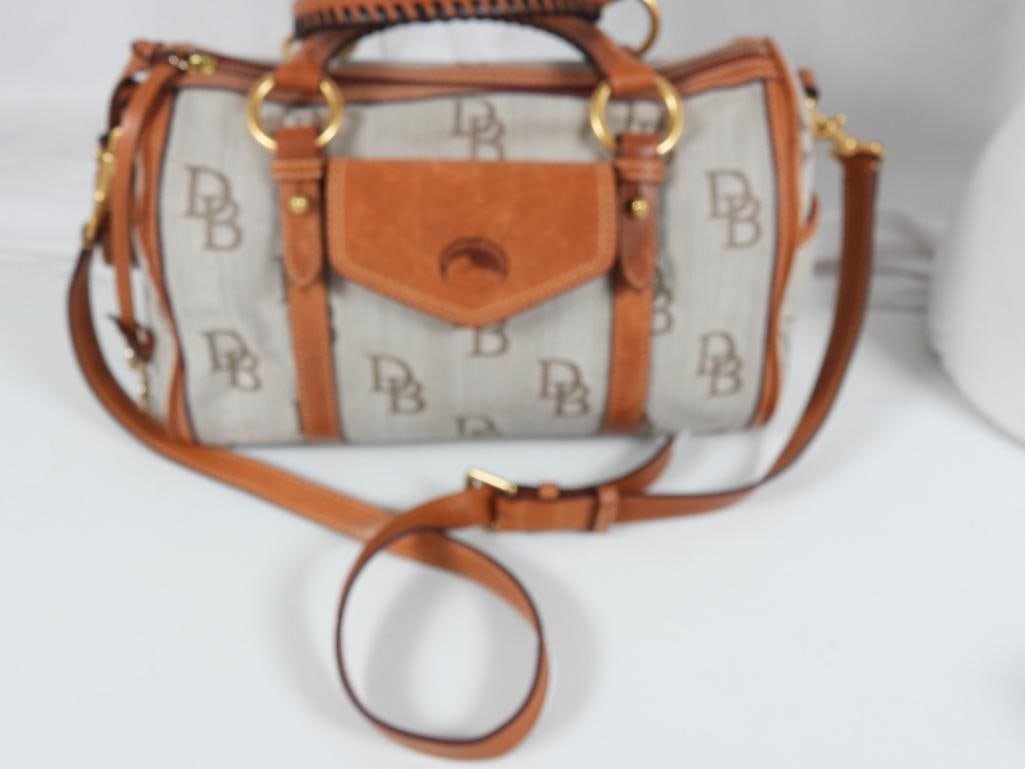 AUTHENTIC Dooney & Bourke Logo and Vachetta leather hand bag: GUARANTEED AUTHENTIC BEAUTIFUL DOONEY & BOURKE Florentine Monogram Logo canvas and tan leather satchel Ladies Designer handbag with Vachetta leather trim, braided handles, Interior trim and classic re