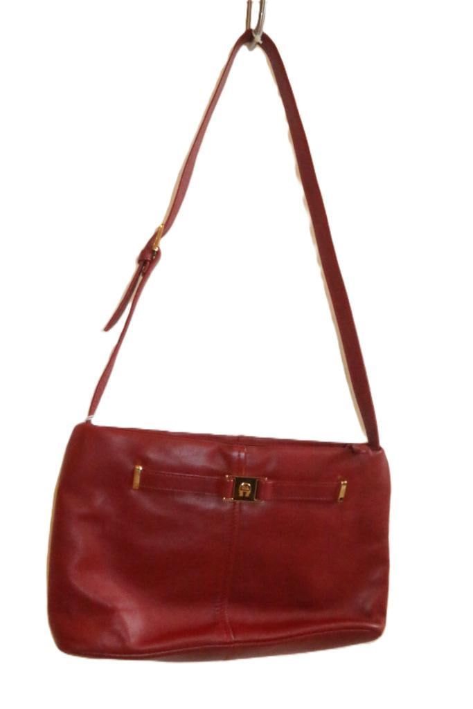 Cranberry Red Authentic Ladies Aigner shoulder bag: AUTHENTIC AIGNER Red Leather. 12"W x 7"H x 3"D. shoulder strap has a 14" drop and can be adjusted 1" shorter or longer. Center zip pocket and 2 open pockets. Full zip pocket has an addition slip pocke