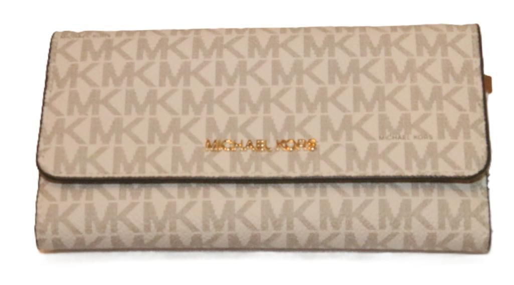 NEW Authentic Michael Kors signature Wallet: BRAND NEW WITH TAGS Michael Kors Jet Set Large Logo trifold Wallet RETAIL $298.00. all tags inside. 16 Card slip pockets, 1 ID pocket. 4 billfold slip pockets. 1 Exterior zip pocket for coins. Michael