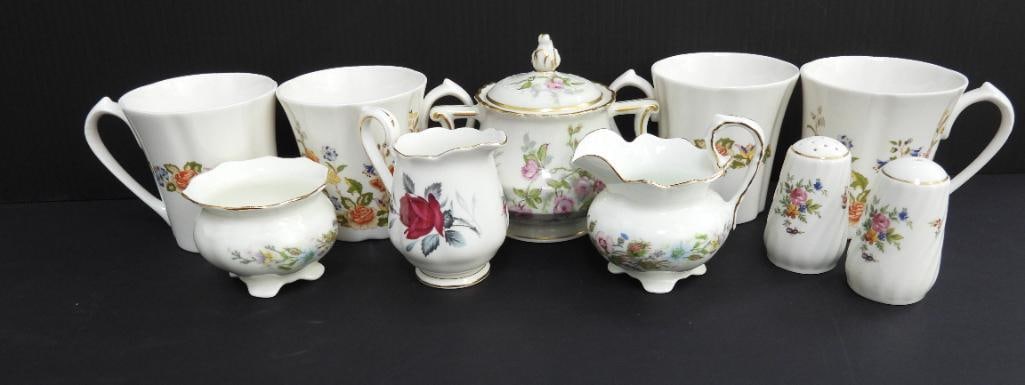 LOT OF 10 VINTAGE BONE CHINA TEA SETS: Included are four discontinued and collectable Aynsley "Cottage Garden" China mugs with floral and butterfly motifs displayed on its face 4.5"x3.5"x4", dicontinued and collectible Haviland Limoges sug