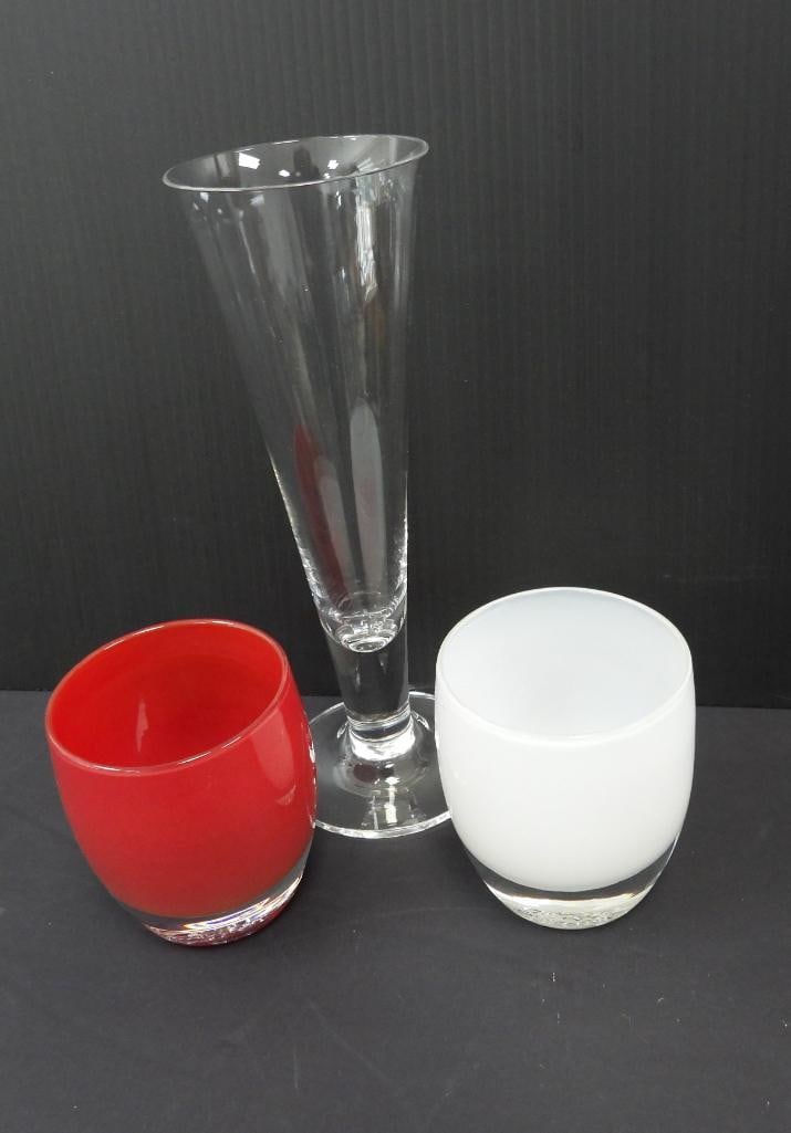 LOT OF 3 VINTAGE GLASS VASE: Featured is a tall trumpet shaped bud vase mad by Tiffany & Co. 3"x3"x9.5" followed by two smaller handblown glass candleholders of white and red made by Glassy Baby Co. 3"x3"x3.5"