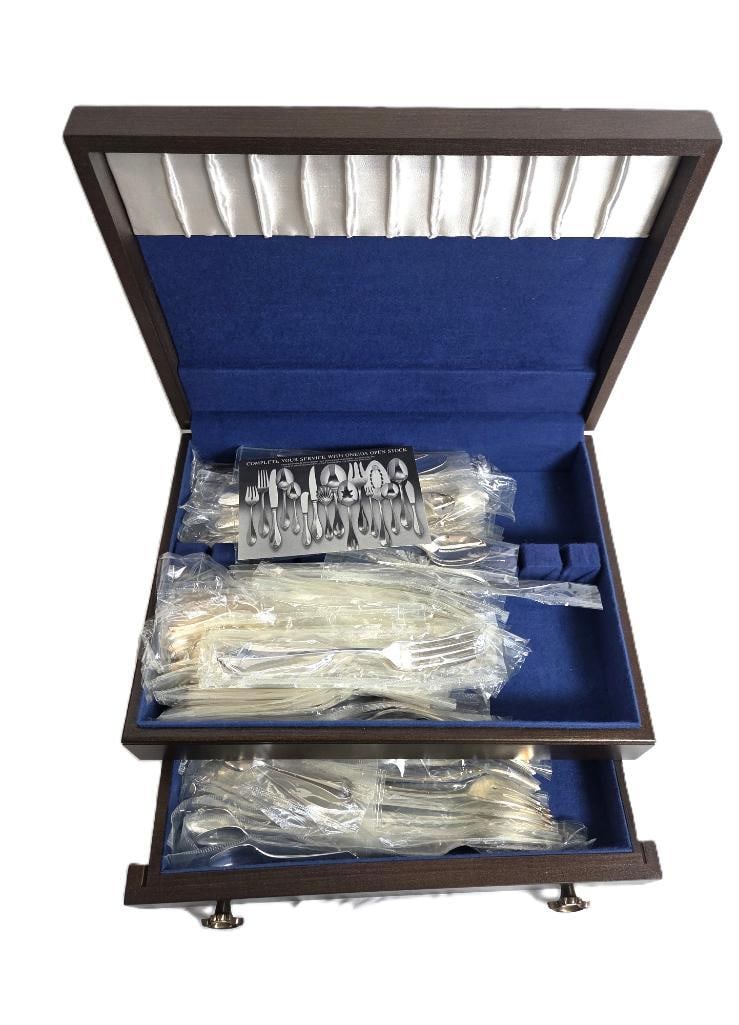 HUGE LOT OF SILVER PLATED UTENSILS: included are various silver plated utensils such as forks, spoons, steak knives, sugar spoons ect. All still pre packaged and unopened with original storage case