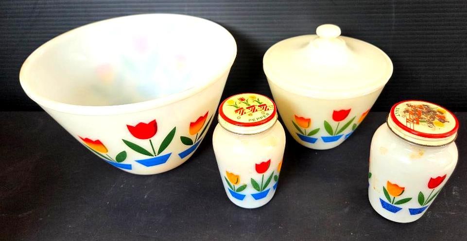 LOT OF 4 VINTAGE ANCHOR HOCKING GLASSWARE: Included are 2 matching salt and pepper shakers 3"x3"x4.5" with visible rust on the salt shaker, a smaller lidded jar 6"x6"x6", and a large bowl 8.5"x8.5"x5.5" (set of shakers and lidded jar come with