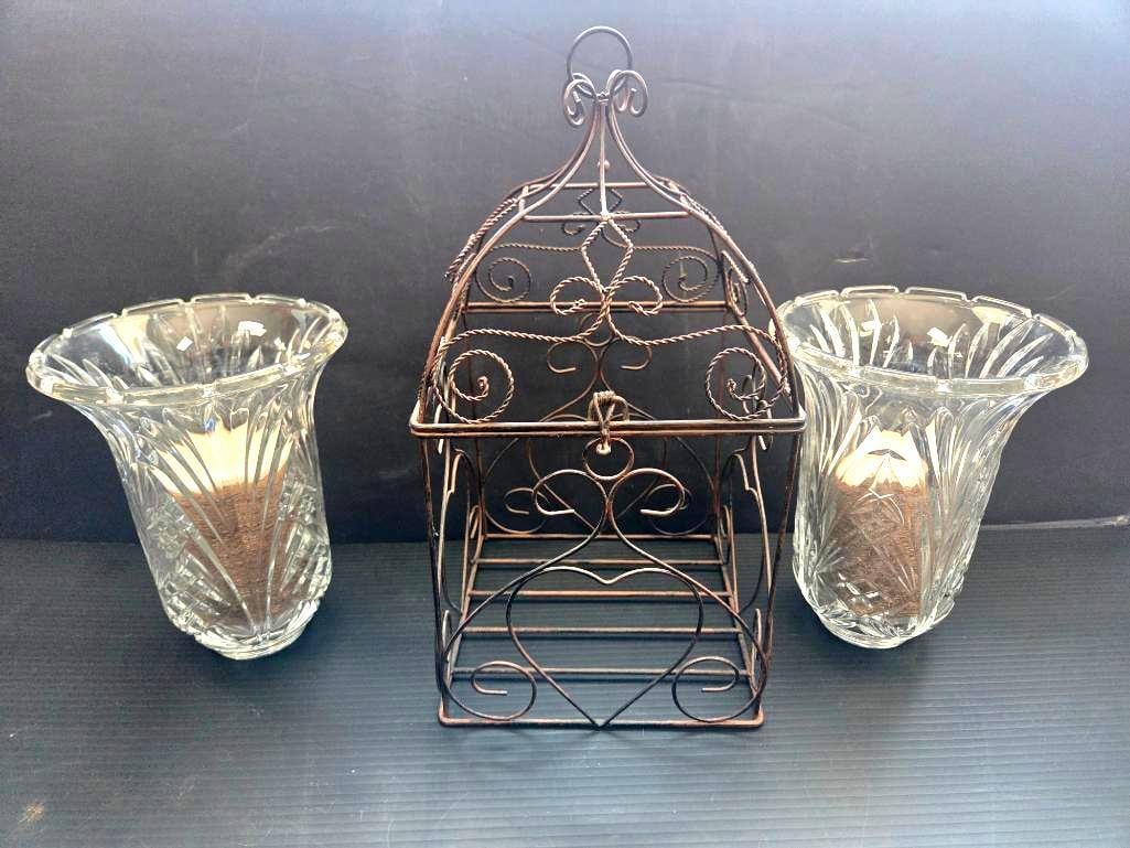 DECORATIVE METAL CAGE: Resembling a bird cage, this item opens at the top to insert other pieces of decorations or a candle 7"x7"x14"