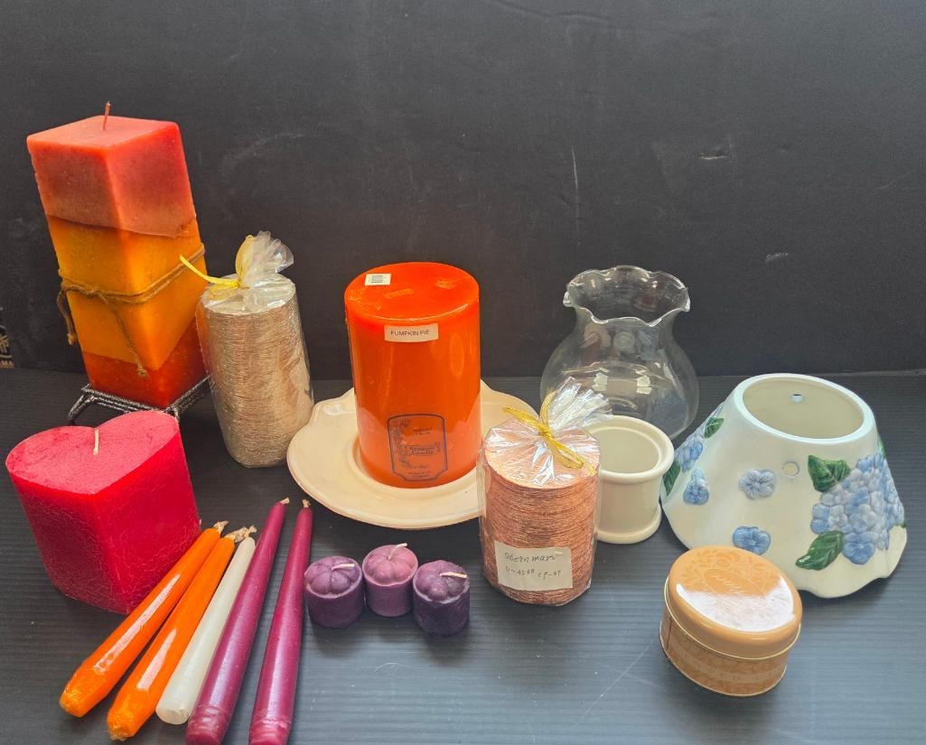 LOT OF 18 CANDLE DECOR: 4 are large cylindrical glittered candles un burnt in tan and copper colors, 1 is a larger fall candle with a 4 footed metallic base, there is a heart shaped candle plus tapered and 3 small purple tea