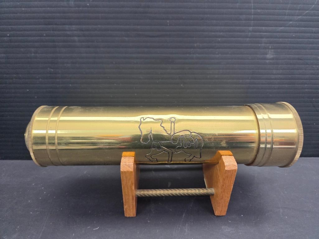 VINTAGE BRASS TOY KALEIDESCOPE: Solid Brass kaliedescope has weight to it being 9" long with a depiction of a carosel horse of the main tube and is in pristine condition