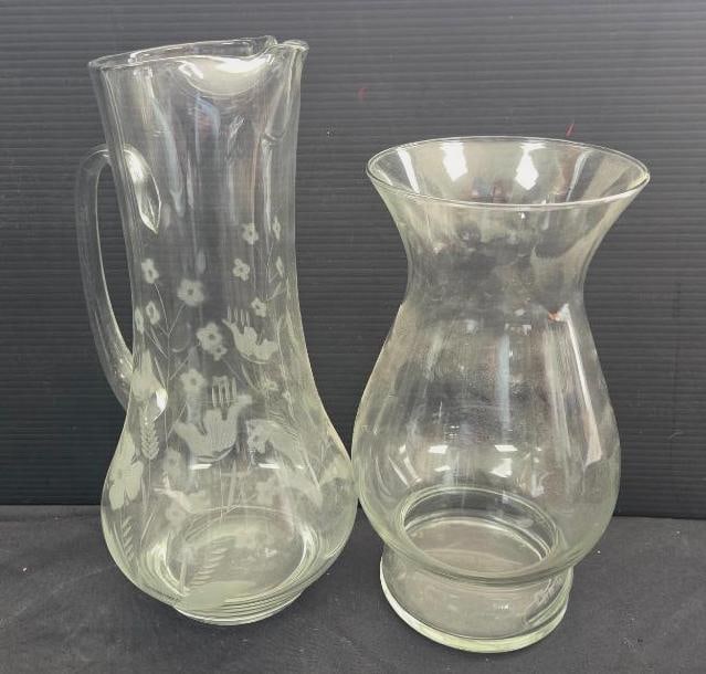LOT OF 2 VINTAGE GLASS PITCHER/VASE: Recognized often as having the Avon Hummingbird pattern the pitcher is a sturdy 13" tall with a vase companion approx. 11" tall