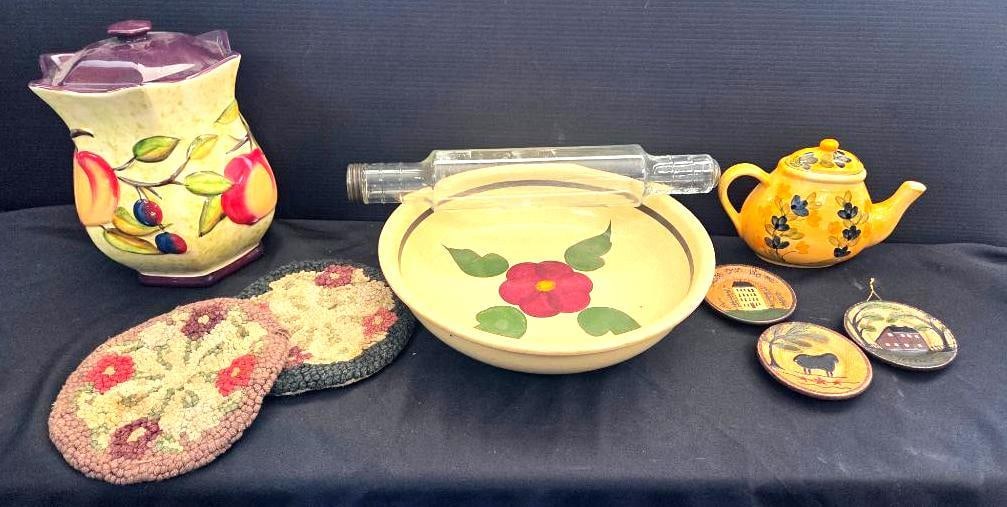 LOT OF 9 VINTAGE KITCHEN/DINING DÉCOR: Included is an old hollow glass rolling pin designed to be filled with ice water for dough rolling, 2 floral hot pads, a large Watt pottery 13.5" wide spagetti dish, classic caramics California pantry