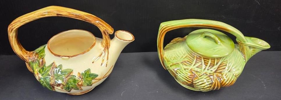 LOT OF 2 VINTAGE VINTAGE MCCOY WOODLAND POTTERY: Included are two teapots approx 10"x6"x8" with an ivy and pine tree design