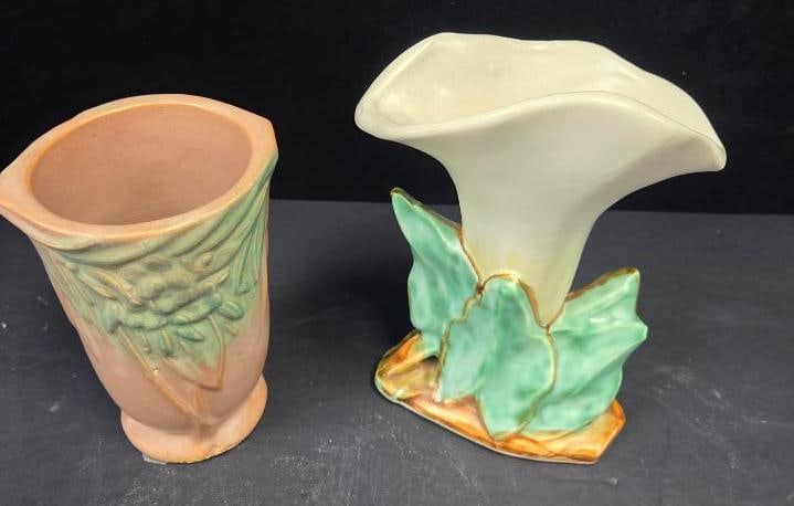 LOT OF 2 MCCOY VINTAGE VASES: Vases are both have flower motifs with on having the complete shape and color of a white calla lilly 5.5"x4"x8" and the other in a simple vase design with a small floral motif towards the lip 4.5"x4"x