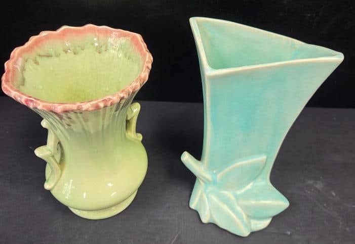 LOT OF 2 VINTAGE MCCOY BUD VASES: Bud vases have soft blue and green colors to accent their designs of a simple leaf motif 5"x3"x8" and a classic urn design with a double handle 5"x5"x7.5"