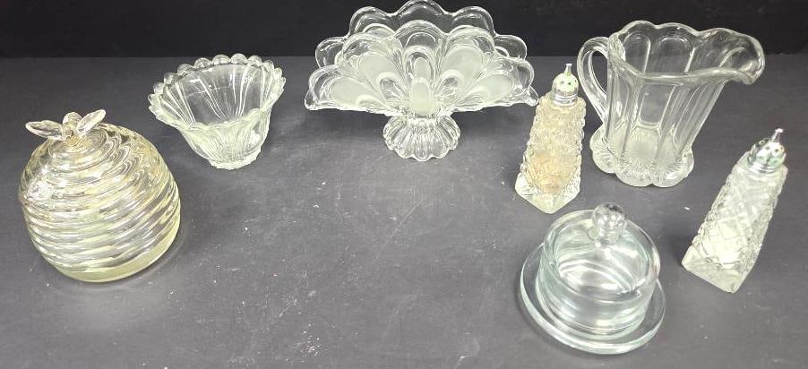 LOT OF 7 GLASS DINNER SETS: Included is a single Heisey pitcher with a colonial style 6"x4"x5", 3 serving bowls (two of which have lids and on that has a very unique beehive shape), a bohemian style "Bannana Boat" 8" long, and 2