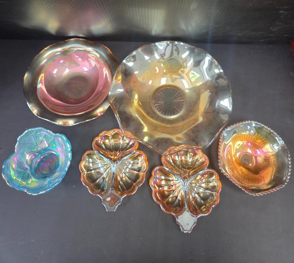 LOT OF 6 VINTAGE JEANETTEE CARNIVAL GLASS: Finished in Iredescent marigold colors, 2 pieces are shaped in a 3 piece clover patter "Doric", also included are 4 bowls 11.5" to 9" and 6.5" in diameter with the last one being iredescent blue and