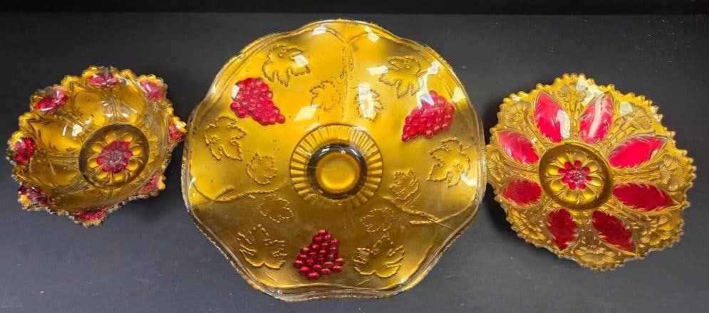LOT OF 3 ANITQUE GOOFUS GLASS BOWLS: Each bowl is finished in gold and red designs with the largest featuring a grape motif approx. 10" in diameter and two smaller ones featuring carnations and an arrow head design approx. 6" in diameter