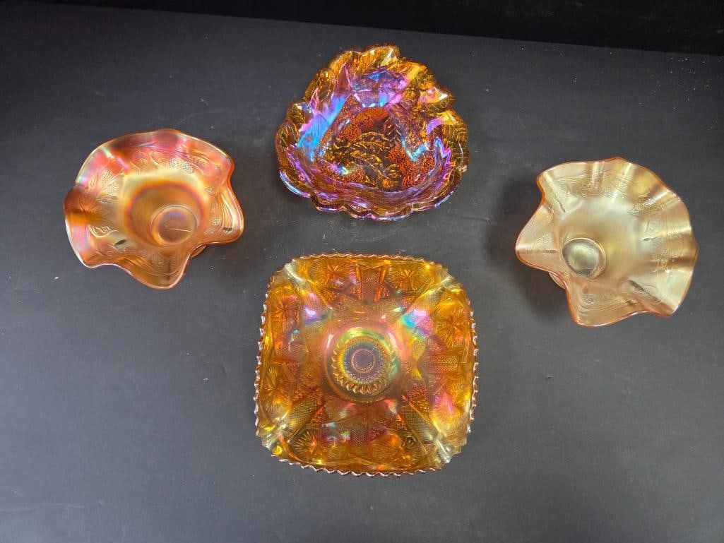 LOT OF 4 VINTAGE CARNIVAL GLASS: 4 bowls all have the iconic iredescent marigold color with 3 having a nature design with leaves and vines and the last designed with a starburst pattern all are approx. 7" in diameter