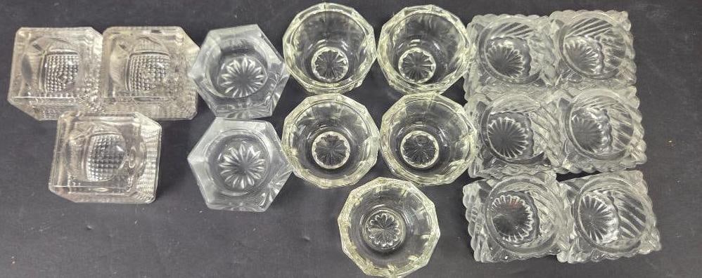 LOT OF 16 VINTAGE GLASS SALT CELLARS: All cellars are in pristine condition with no visible chips, approx. 1.5"x1.5", and come in varying shapes and designs
