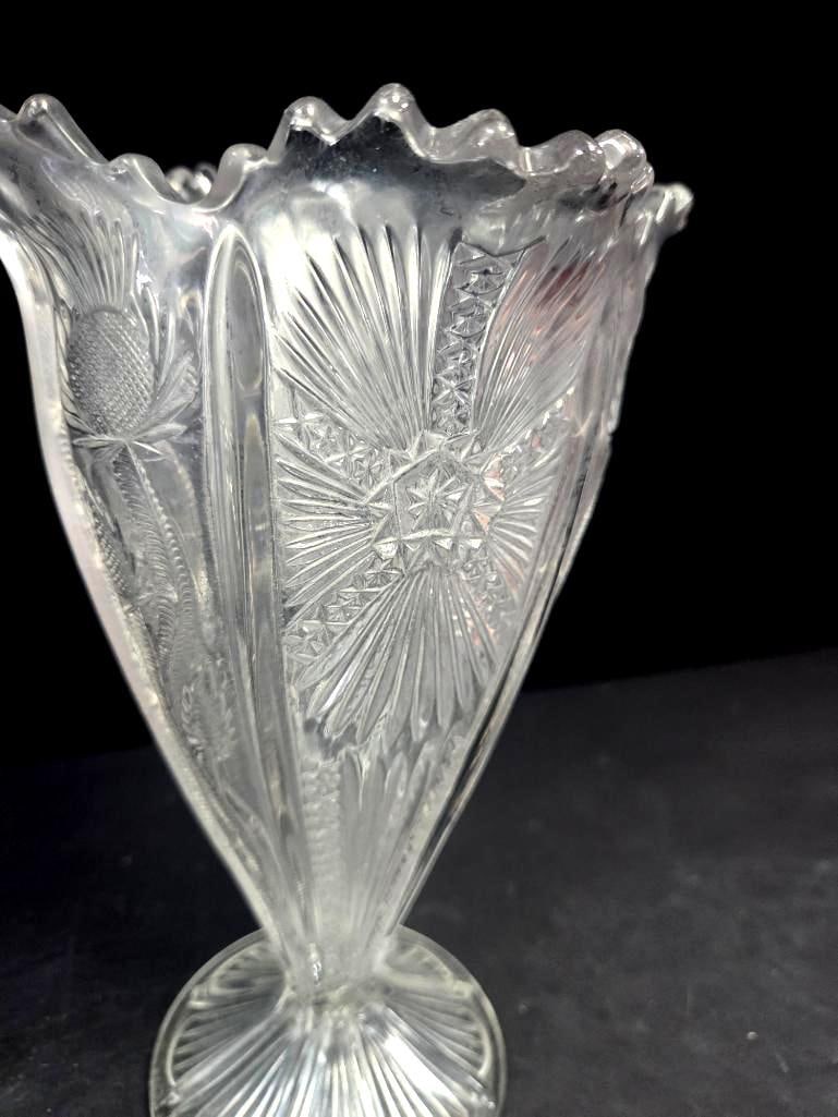 Pressed Glass Thistle Pattern Fan Vase: Single pressed glass vase in the thistle pattern, fan-shaped body with ruffled/scalloped rim on a round starburst-cut foot. Approx. 8"H x 4.5"W at rim.