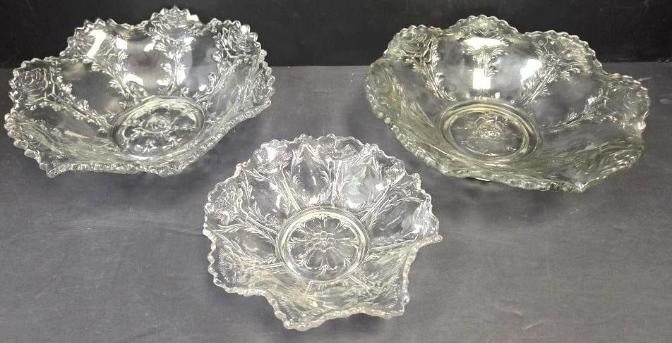 Pressed Glass Rose-Pattern Bowls, Set of Three: Two matching pressed glass scalloped-rim bowls with rose and leaf relief pattern and rose-medallion center, approx. 8" diameter each, together with one smaller pressed glass bowl in the same rose