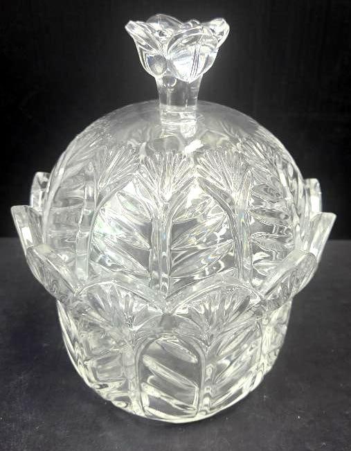 Cut Crystal Covered Candy Dish: Pressed crystal covered candy dish with petal/leaf-cut relief pattern, domed lid with knob finial, and a scalloped petal-form bowl base with matching cut floral pattern, approx. 6" H x 7" diameter.