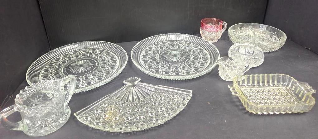 Pressed Glass Serving Pieces, Large Mixed Lot: Large mixed lot of pressed glass serving pieces, including two matching round plates with sawtooth rim and pinwheel/starburst center pattern (genuine pair), approx. 10" diameter each; a ruby-flashed