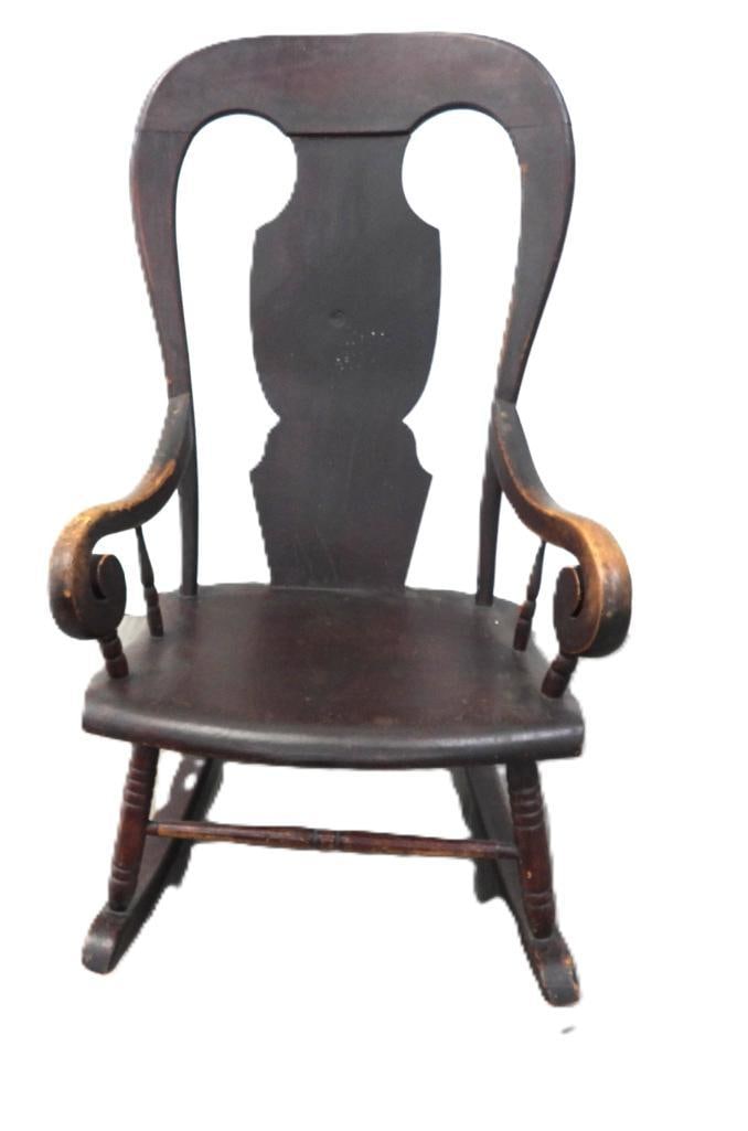 Antique Dark-Finish Queen Anne-Style Rocking Chair: Antique dark-finish wooden rocking chair with a shaped splat back featuring two arched cutouts, scroll arms, and a shaped seat, approx. 40" H.