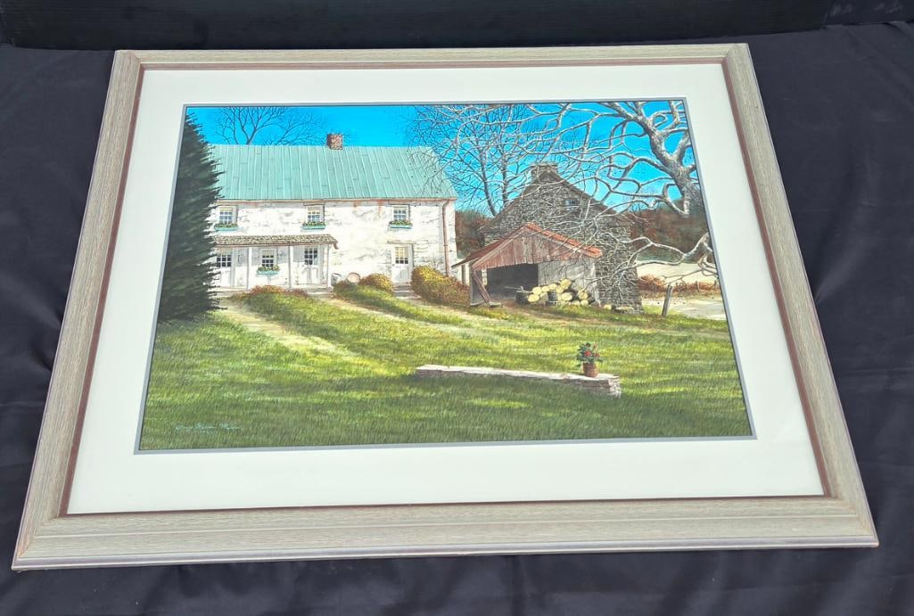 Framed Painting of Stone Farmhouse and Barn: Framed acrylic/gouache painting of a whitewashed stone farmhouse with green metal roof and an adjoining stone barn, autumn/winter scene with bare trees against a blue sky, stone bench with potted