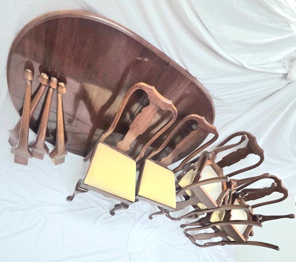 Queen Anne-Style Mahogany Dining Set: Oval Table, Two Armchairs, and Four Side Chairs ETHANN ALLEN: Matching Queen Anne-style mahogany dining set comprising an oval drop-leaf table with four removable cabriole legs and pad feet, two matching armchairs, and four matching side chairs, all with